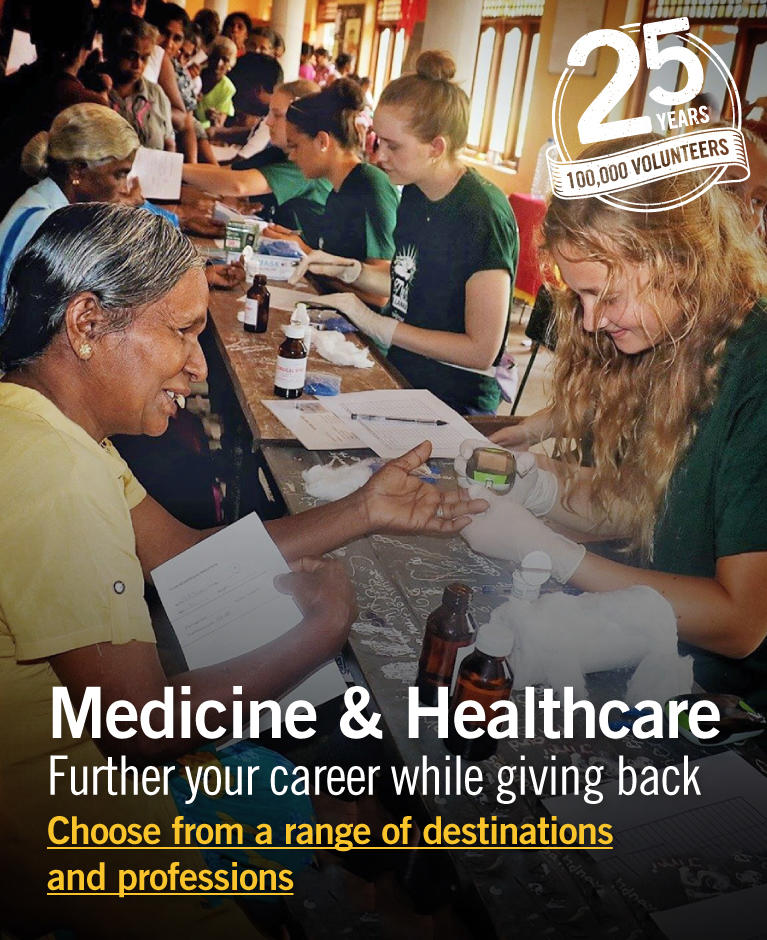 Projects Abroad Medicine volunteer treats a young boy as part of a medical outreach programme in Phnom Pehn, Cambodia