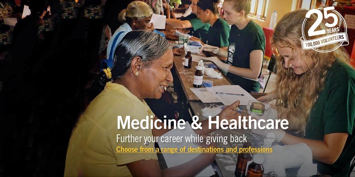 Projects Abroad Medicine volunteer treats a young boy as part of a medical outreach programme in Phnom Pehn, Cambodia