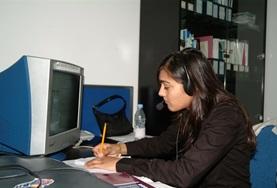 Business A Business intern works at her desk at her volunteer placement in China.