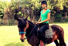 Argentina An Equine Therapy volunteer in Argentina spends time with a therapy horse.