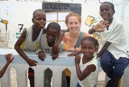Building A High School Project Building & French volunteer spends time with the children at the school in Senegal where she is doing renovation work.