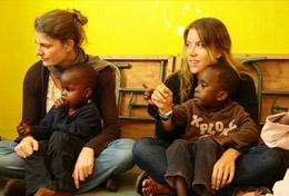 Kenya High School Project volunteers spend time with local children in Kenya, helping with their education and development.