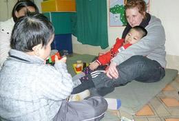Vietnam High School Project volunteers work with disabled children in Vietnam.