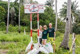 Conservation & Environment High School Project Conservation & Community volunteers stand in front of the rubbish they collected during a beach clean-up in Cambodia.