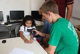 Medicine & Healthcare A Public Health volunteer in Mexico gains experience measuring blood pressure during his short-term high school internship.