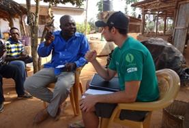Togo An International Development volunteer discusses sustainable business plans with the staff member of a local NGO in Togo.