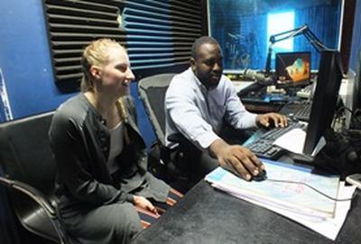 Jamaica A Journalism intern works on a radio broadcast with a local radio DJ in Jamaica.