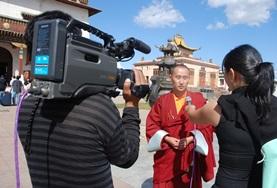 Mongolia A Journalism intern interviews a local person for a news station in Mongolia, Asia.