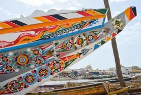 Language Courses Painted boats in St Louis, Senegal, where we run our French language course.