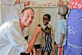 Medicine & Healthcare A Dentistry intern gives a child a high-five after a successful dentisty check-up at a hospital in Tanzania.