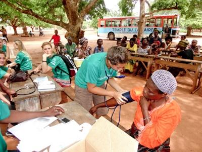 Blood pressure A female Projects Abroad Jamaica volunteer checks the blood pressure of a man in a medical project.