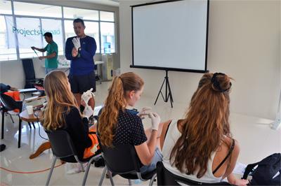 Medical volunteers receive training at their project Projects Abroad Medical volunteers view a presentation at their placement in the Philippines, Asia