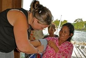 Medicine & Healthcare A Medicine intern measures a local woman's blood pressure at her volunteer Medical placement in Cambodia.