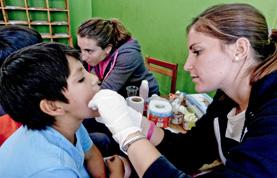 Peru A Medicine intern examines a child during a medical outreach in Cusco, Peru.