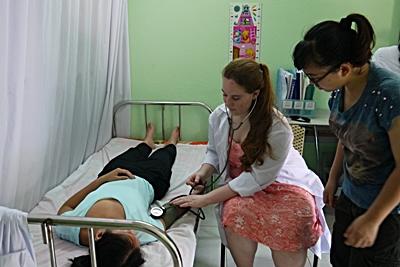 Medical Volunteer Vietnam Medical volunteer Kendall Small (USA) learns to take vital signs on fellow Delaware volunteer Selina Su (USA) at Thuy An Rehabilitation Center