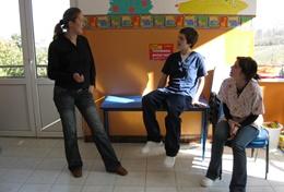 Romania Physiotherapy interns volunteering in Romania listen as a local physiotherapist teaches them about therapy techniques.