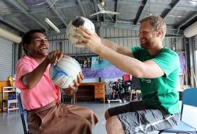 Medicine & Healthcare A Physiotherapy intern treats a disabled man in Samoa.