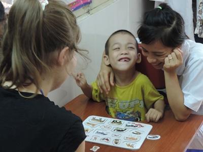 Volunteers in a occupational therapy project in Vietnam, Asia. Female volunteers busy in a occupational therapy project in Vietnam, Asia.