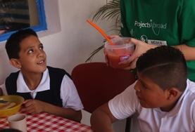 Social Work A Social Work volunteer in Mexico sits down for a meal with local children to chat to them and learn more about them during her internship.