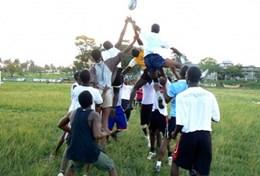 Ghana Sports players catch the ball during a line-out in a rugby match at our volunteer Rugby placement in Ghana.