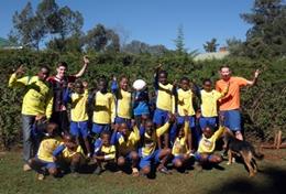 Kenya A local soccer team poses together before a sports lesson at our volunteer School Sports placement in Kenya.